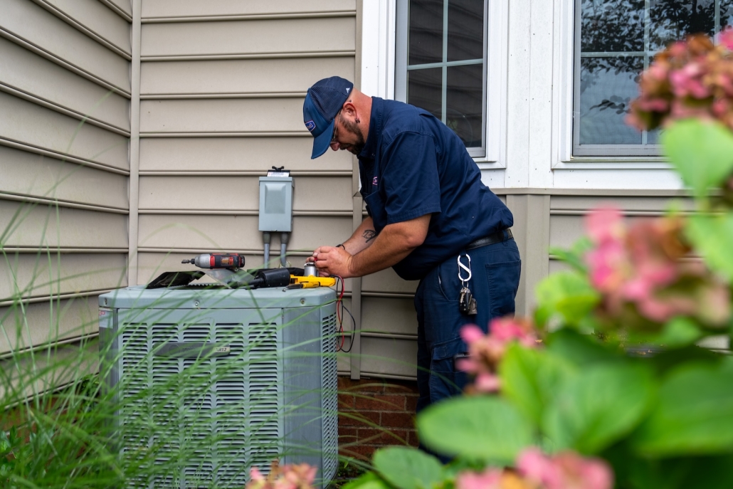Burch worker maintaining outdoor unit